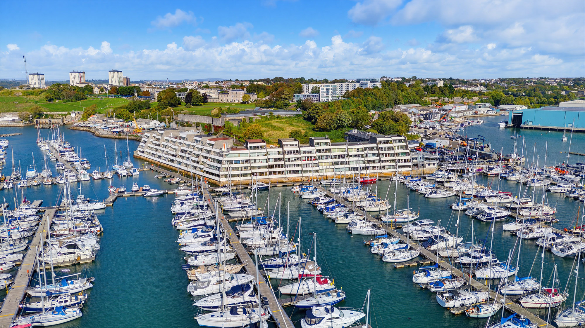 Aerial drone photograph of Plymouth marina, waterfront property and surrounding boats and buildings