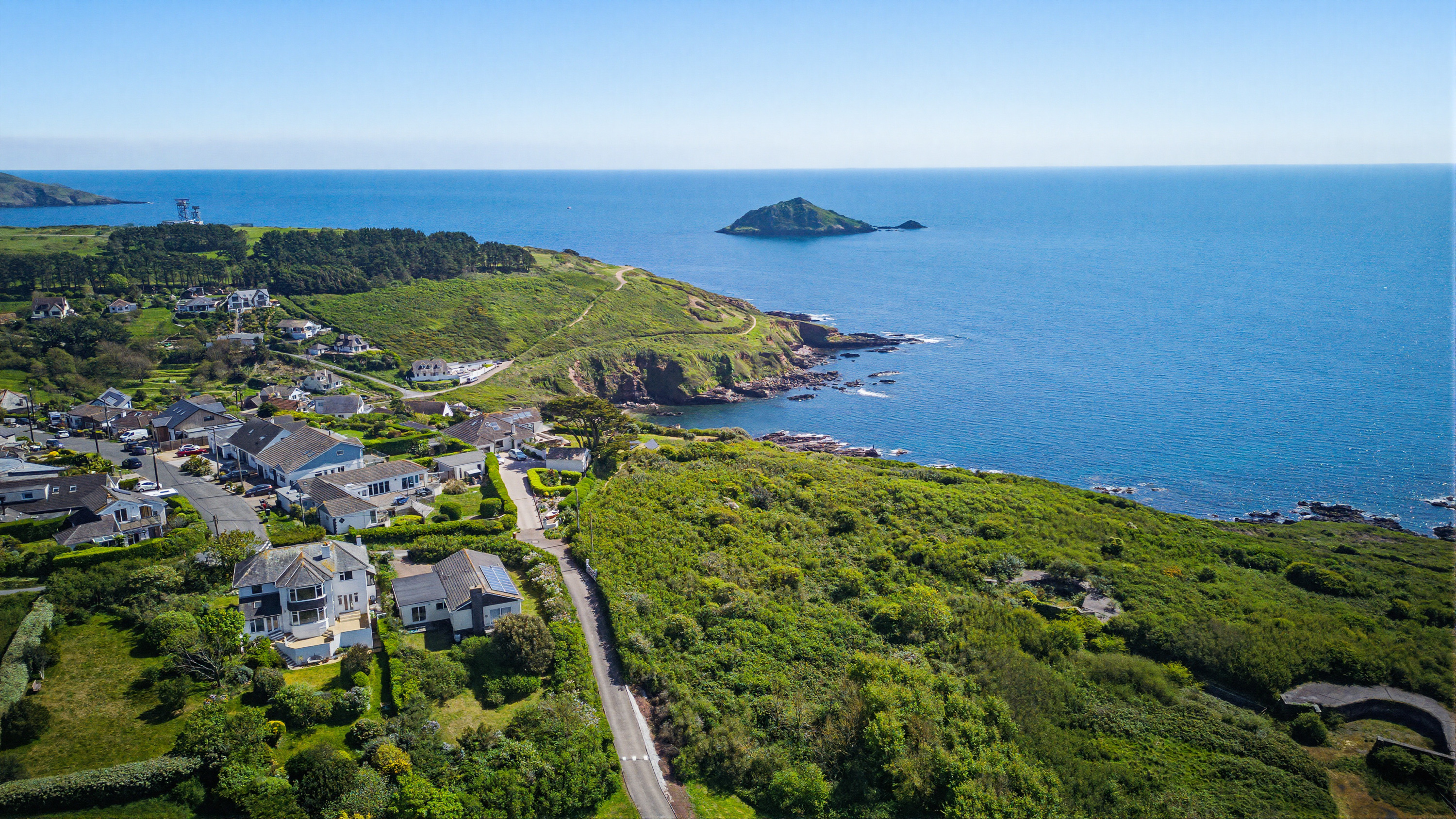 Aerial drone photography showing a coastal holiday property and surrounding landscape