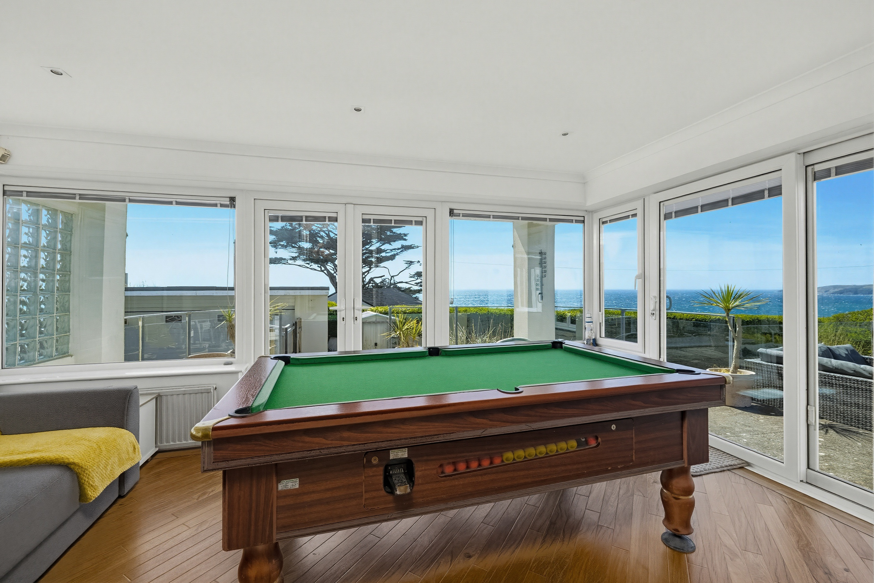 Holiday let games room featuring a pool table and coastal views