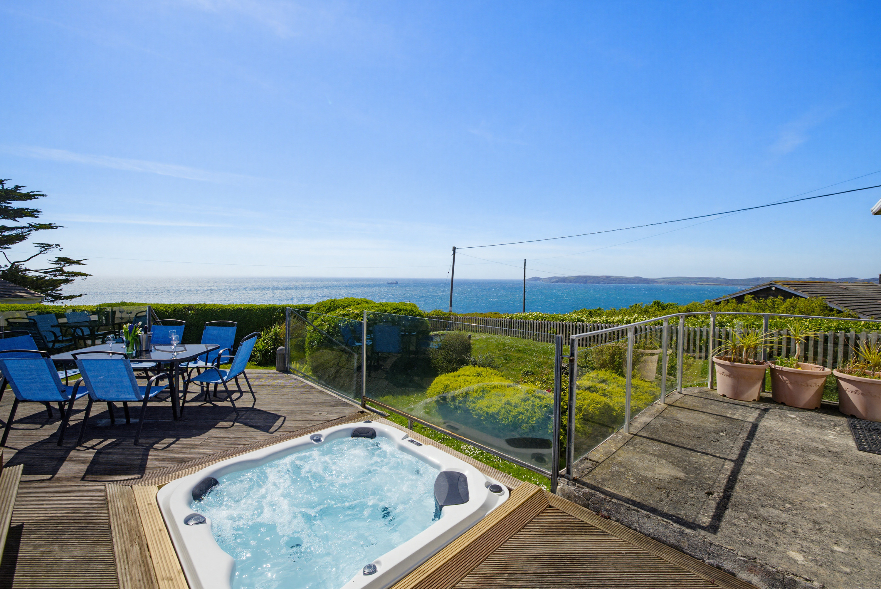 Holiday let with hot tub, outdoor dining and coastal views photographed by 241Photography